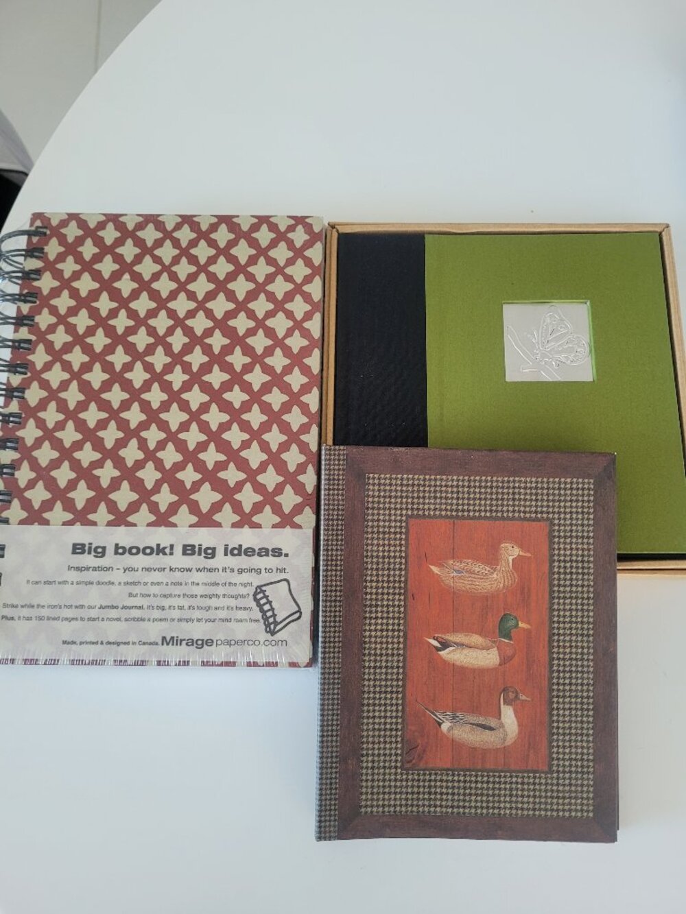 Three brand new notebooks journals